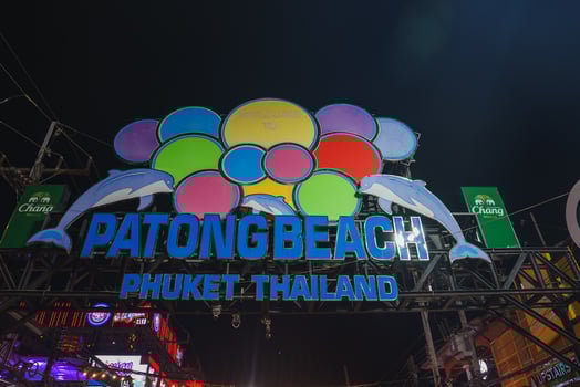 Illuminated Patong Beach Sign with Dolphins in Phuket, Thailand photo