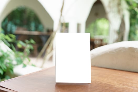 blank menu on table in outdoor restaurant photo