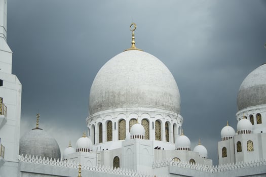 Sheikh Zayed Grand Mosque Domes Against a Dramatic Overcast Sky photo