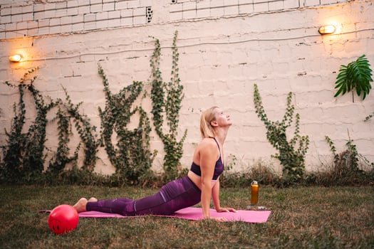 Mother embraces fitness after childbirth in serene outdoor setting photo