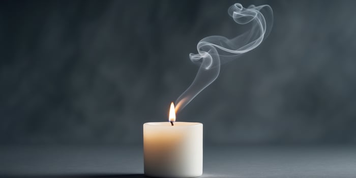 Tranquil White Candle and Smoke on Dark Background - Copy Space for Business Concept photo