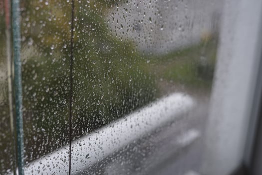 Rain drops close up on window glass outdoors. Summer rain. Texture of water in heavy rain. Macro. photo
