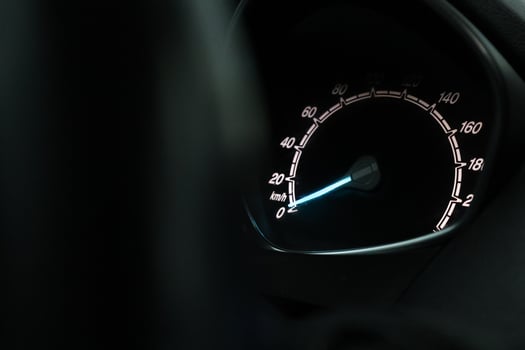 Close up shot of a speedometer in a car. At an engine speed of 1800 rpm on Car dashboard photo