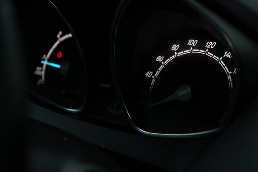 Close up shot of a speedometer in a car. At an engine speed of 1800 rpm photo