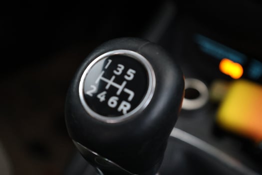 Black gear of Manuel car. A 5 speed gear shift up close. photo