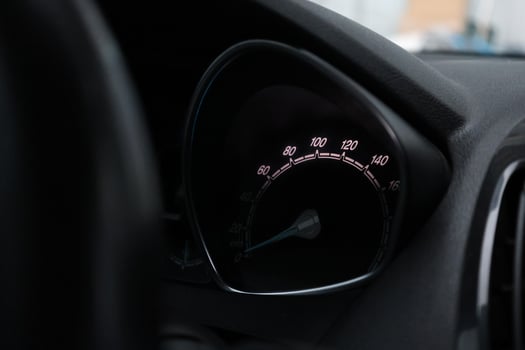 Close up shot of a speedometer in a car. At an engine speed of 1800 rpm on Car dashboard. photo