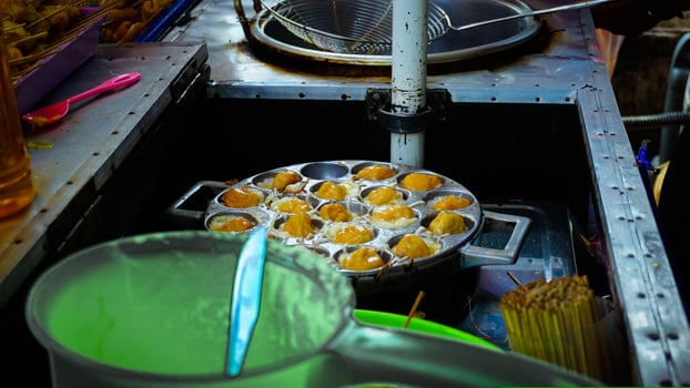 Street Vendor Cooking Traditional Snacks photo
