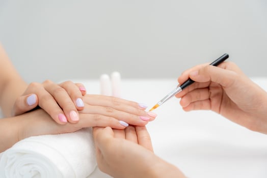 female receive care service by professional Beautician Manicure at spa centre. Nail beauty salon use nail file for Glazing treatment. manicurist make nail customer to beautiful. body care spa photo