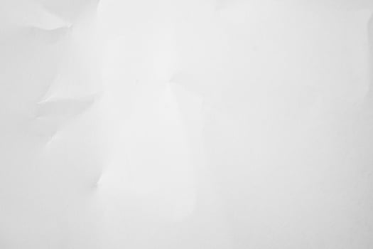 Crumpled white paper, a white sheet of paper with crumpled edges photo