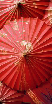 A group of red umbrellas with gold accents photo