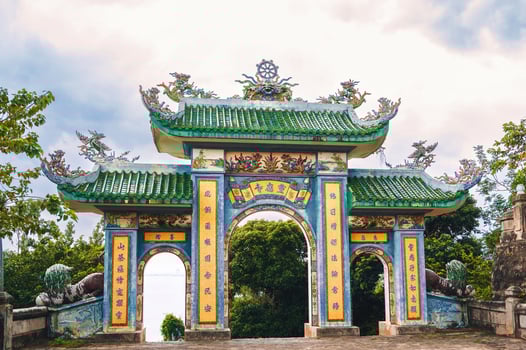 Beautiful Gate of Linh ung Pagoda with blue sky at Chua Linh Ung Bai But Temple, Da Nang, Vietnam. photo