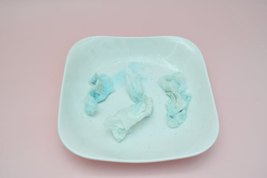Used Tissues on a Light Green Plate photo
