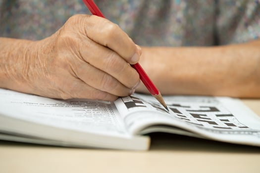 Alzheimer disease AD, Asian elderly woman playing sudoku puzzle game to practice photo