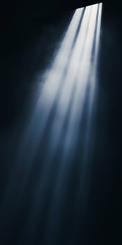 Rays of light piercing through a dark space, creating a mysterious and atmospheric ambiance. photo