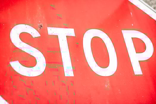 Red and white stop traffic sign close up photo