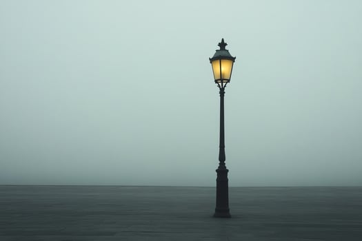 Vintage Street Lamp Illuminating Foggy Urban Environment at Dusk photo