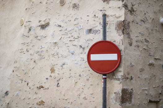 No entry traffic sign against an old stone wall photo