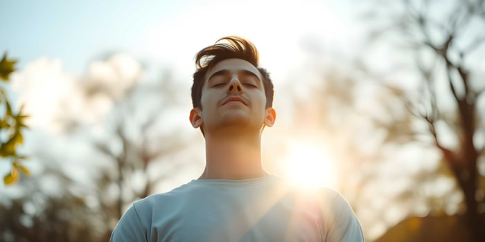 A man is looking up at the sun photo