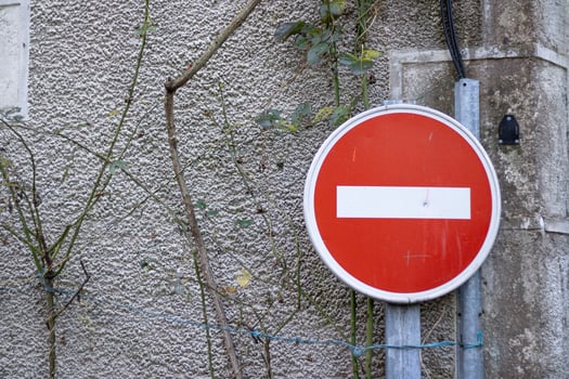 No entry traffic sign against an old stone wall photo