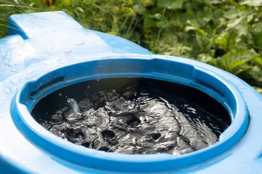 water collection tank under a roof with a drain. photo