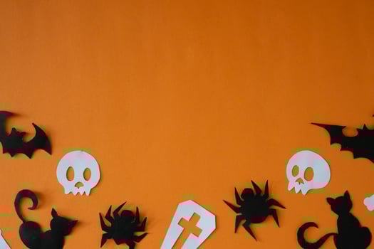 Graveyard and skull paper cut out for copy space background photo