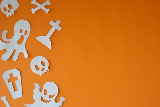 Coffin and graveyard paper cut out for copy space backdrop photo