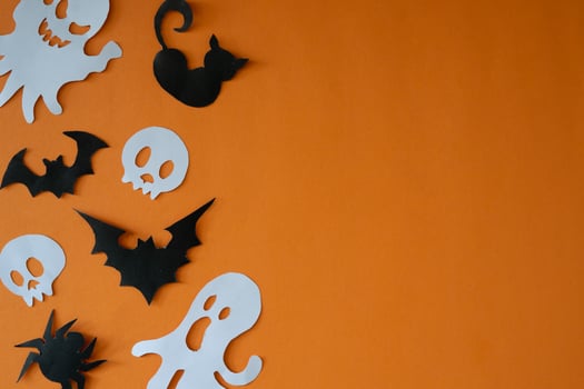 Skull and ghost ornament for copy space backdrop photo
