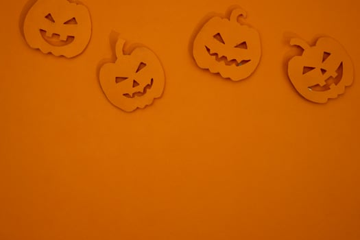 Pumpkin paper cut out for copy space background photo