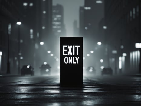 Silhouette of Exit Only Sign on City Street at Night photo