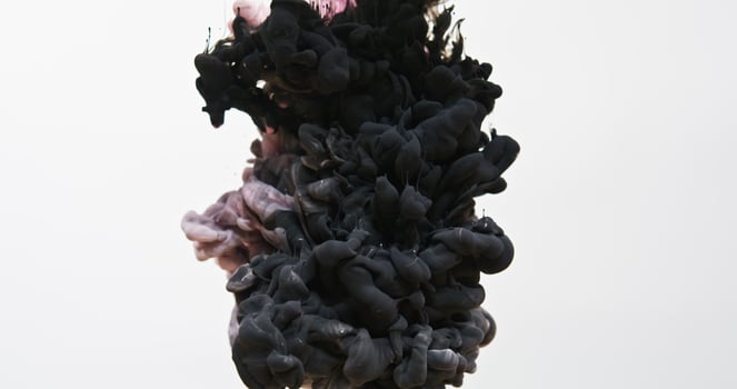 a black and white liquid in water photo