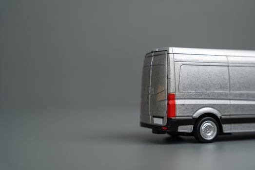 The back of a departing goods delivery and logistics van and copy space. Delivery and other services in the city. photo