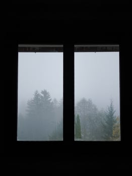 Foggy forest landscape viewed through a window in chamonix, france photo