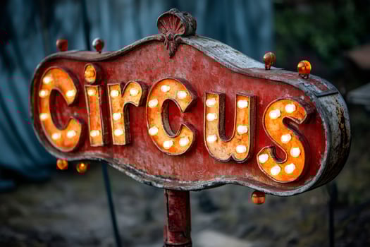 Illuminated circus sign displaying entertainment and excitement photo