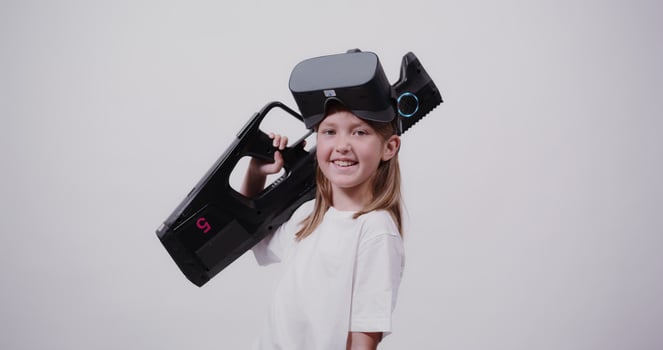 A girl holding a virtual reality headset photo