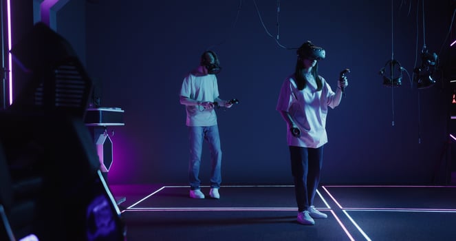 Two people in a room with neon lights photo