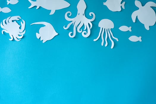 Fish border in paper cut out craft photo
