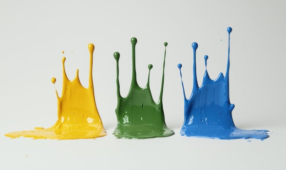 Colorful paint splashes in yellow, green, and blue photo
