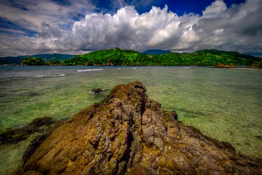View of the sea with a rock in the foreground photo