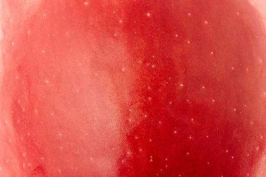 Apple texture as background. Red apple macro photo. photo