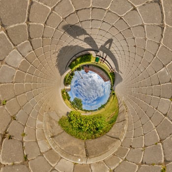 blue inside overlooking old town, urban development, historic buildings surrounded by a frame of paving slabs. Transformation of spherical 360 panorama in abstract aerial view. photo