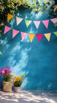 Colorful bunting on a blue wall photo
