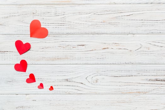 Valentine day background with red hearts, top view copy space photo