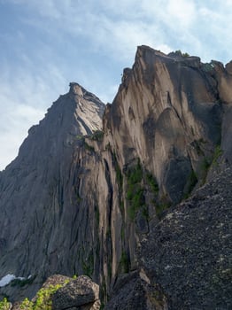 Huge sharp rocks. Pointed cliff. Vertical view. photo