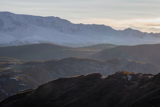 Silhouette of the evening mountains at sunset. photo