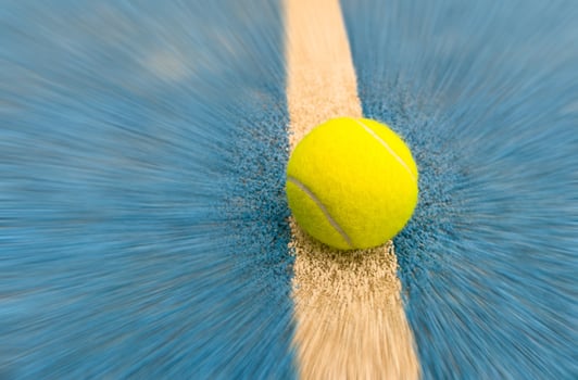 balls near the net of a blue paddle tennis court, sports courts photo
