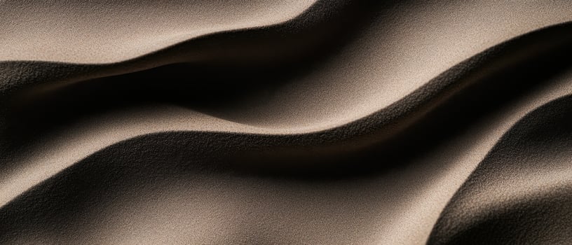Soft, flowing fabric with gentle waves and shadows creating depth and texture. smooth surface reflects light, enhancing elegant appearance photo