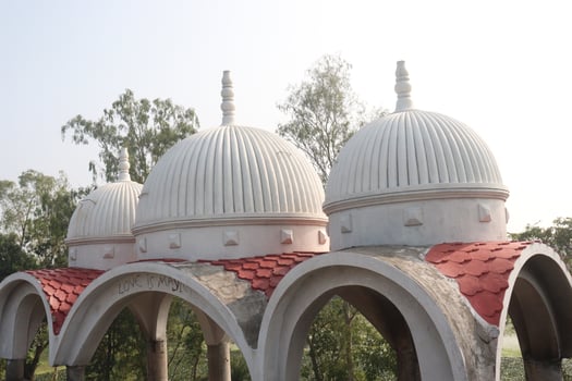 A white dome with red tiled roof photo