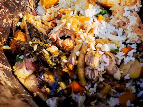A pile of food that is in a brown container photo