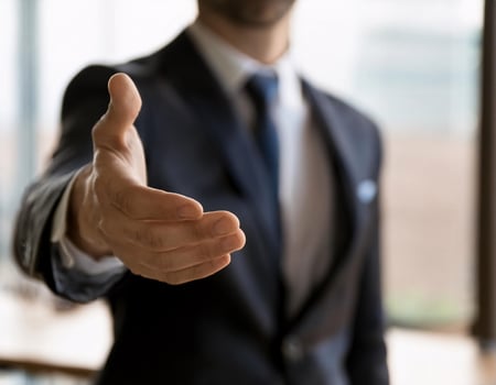 Seal the Deal Young Businessman Offering a Handshake photo
