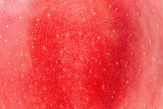 Red apple texture. Macro photo of apple skin. Vitamins, fruit